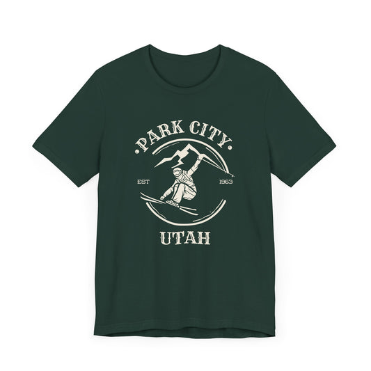 Forest green t-shirt with off-white skier graphic and Park City Utah text