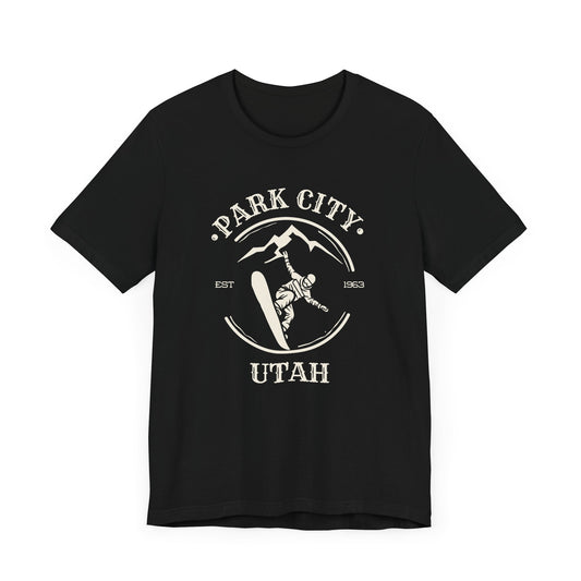 Black crew neck t-shirt with 'Park City Utah' text and a graphic depicting a snowboarder on the front.