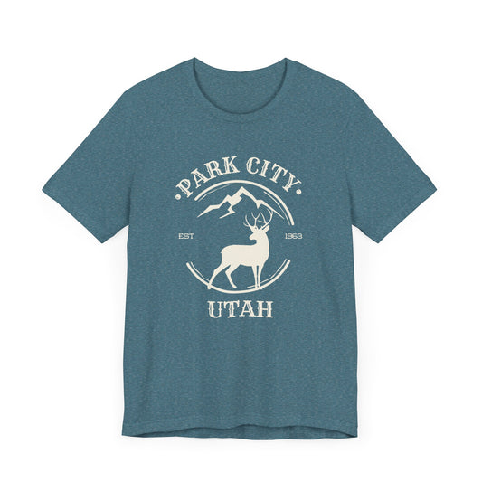 A dark teal Park City Utah minimalist mule deer t-shirt on a white background.